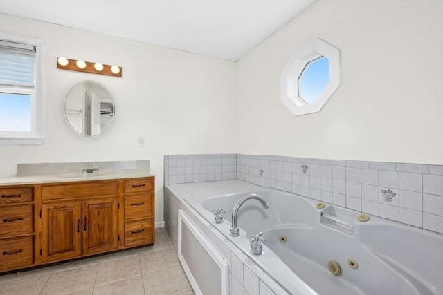 25 Piasta Rd, Dudley, MA 01571 - full bath with plenty of natural light, tile patterned floors, vanity, and a whirlpool tub
