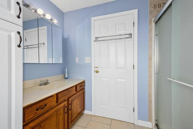25 Piasta Rd, Dudley, MA 01571 - full bathroom with vanity, a stall shower, tile patterned flooring, and baseboards