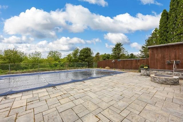 25 Piasta Rd, Dudley, MA 01571 - view of swimming pool with a patio and a fire pit