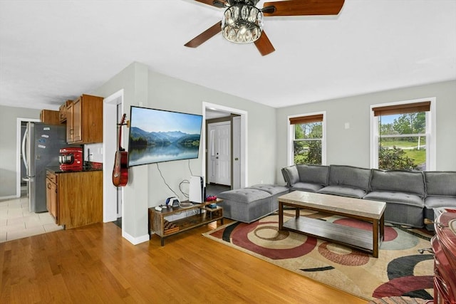 25 Piasta Rd, Dudley, MA 01571 - living area featuring ceiling fan, light wood finished floors, and baseboards