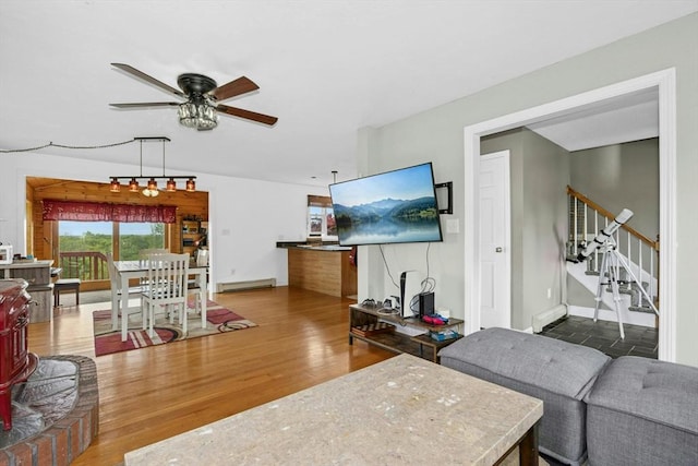 25 Piasta Rd, Dudley, MA 01571 - living area with ceiling fan, wood finished floors, stairs, and baseboards