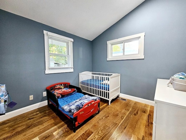 20 Upland Rd, Marlborough, MA 01752 - bedroom featuring vaulted ceiling and wood finished floors