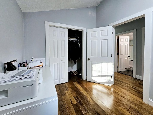 20 Upland Rd, Marlborough, MA 01752 - home office with lofted ceiling and dark wood-style flooring