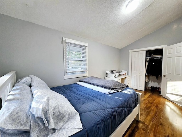 20 Upland Rd, Marlborough, MA 01752 - bedroom with wood finished floors, vaulted ceiling, a closet, and a textured ceiling