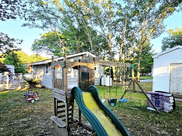 20 Upland Rd, Marlborough, MA 01752 - view of play area with a shed, a lawn, and a wooden deck