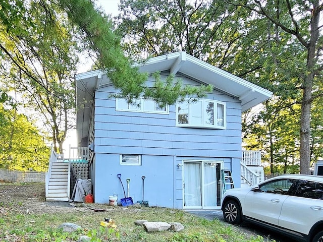 20 Upland Rd, Marlborough, MA 01752 - rear view of property featuring stairway