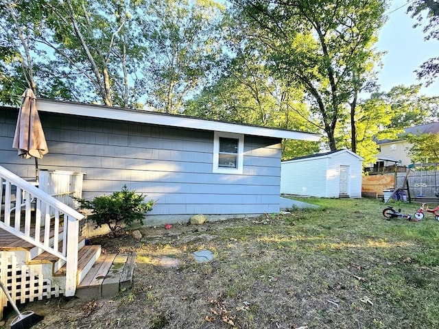 20 Upland Rd, Marlborough, MA 01752 - view of property exterior with a shed