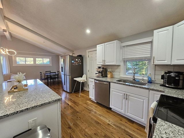20 Upland Rd, Marlborough, MA 01752 - kitchen with appliances with stainless steel finishes, healthy amount of natural light, decorative backsplash, white cabinetry, and recessed lighting