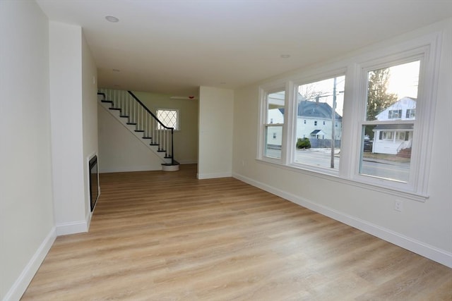 spare room with light hardwood / wood-style floors