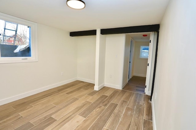 basement featuring light wood-type flooring