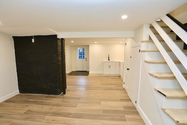 interior space with light wood-type flooring and sink