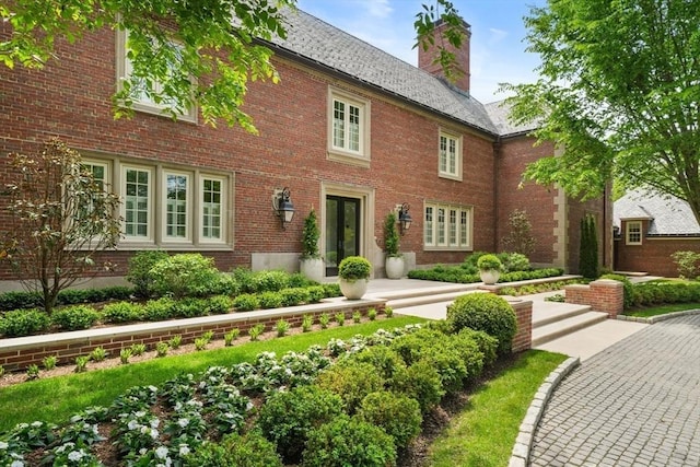 1014 Boylston St, Brookline, MA 02467 - view of front facade featuring brick siding and a chimney