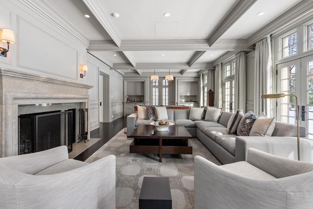 1014 Boylston St, Brookline, MA 02467 - living room featuring wood finished floors, ornamental molding, coffered ceiling, beam ceiling, and a fireplace with flush hearth