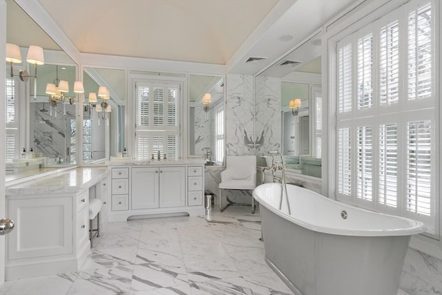 1014 Boylston St, Brookline, MA 02467 - full bath featuring marble finish floors, a soaking tub, vanity, and healthy amount of natural light