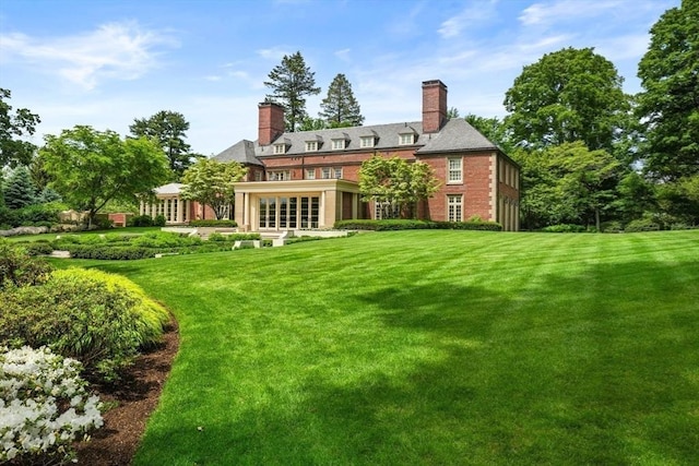 1014 Boylston St, Brookline, MA 02467 - back of house with a lawn, a chimney, and french doors