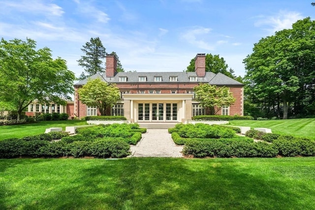 1014 Boylston St, Brookline, MA 02467 - rear view of house featuring french doors, a yard, and a chimney