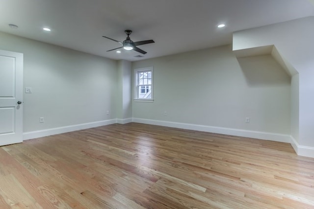 additional living space with ceiling fan and light hardwood / wood-style floors