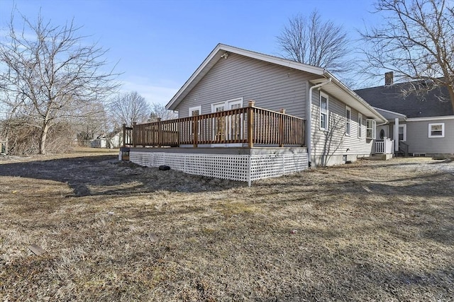 view of side of home featuring a deck