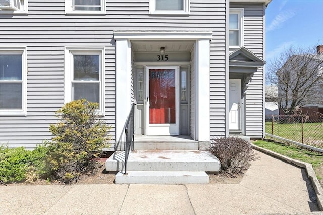 property entrance with fence