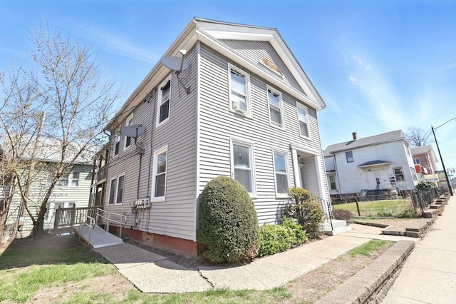 view of property exterior with fence