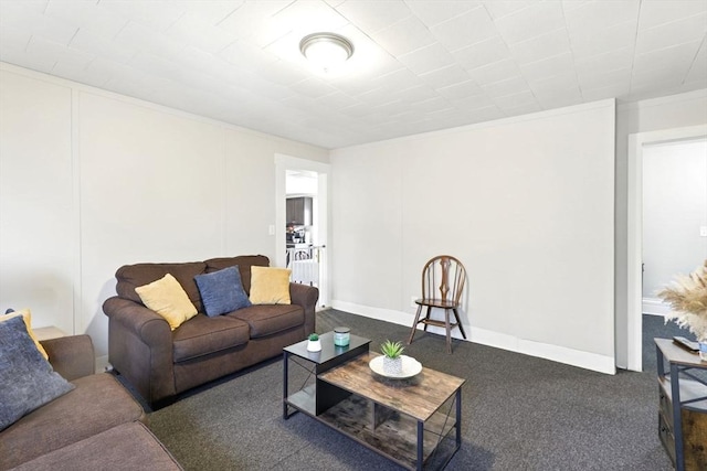 living area featuring carpet floors and ornamental molding