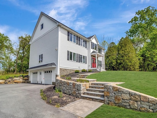 77 Park St, Mendon, MA 01756 - colonial inspired home with an attached garage, stone siding, a front lawn, and driveway
