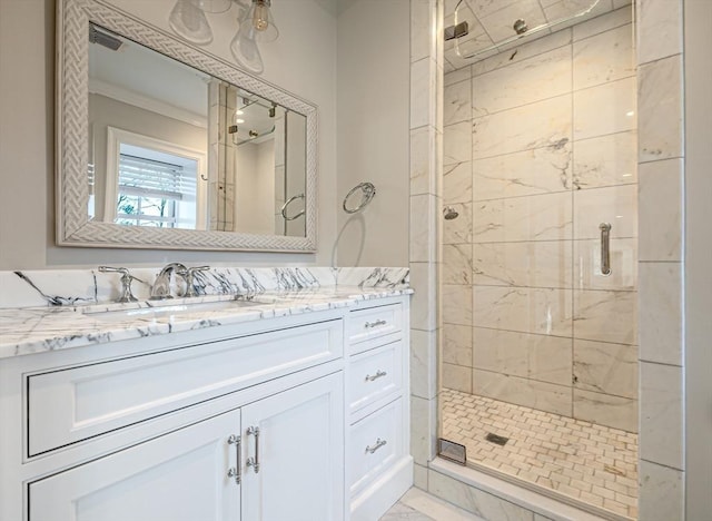 bathroom with vanity and an enclosed shower