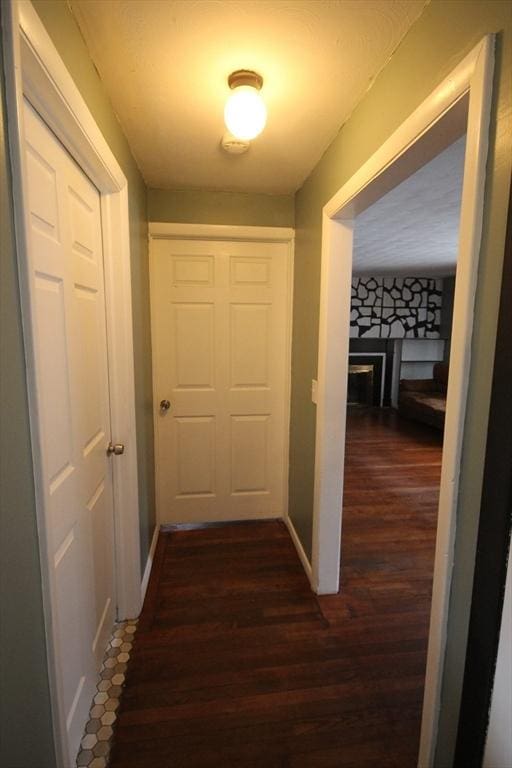 corridor featuring dark wood-type flooring