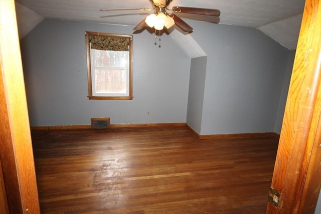 additional living space featuring lofted ceiling, dark hardwood / wood-style floors, and ceiling fan