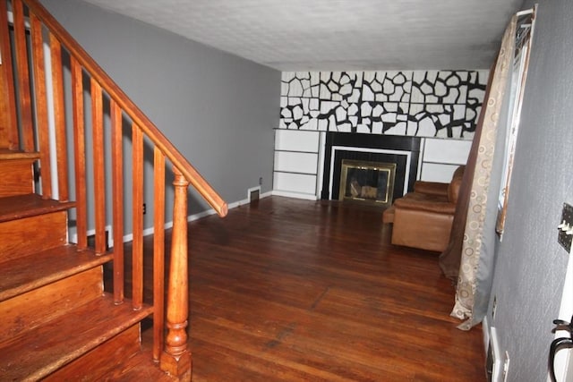 stairway with wood-type flooring