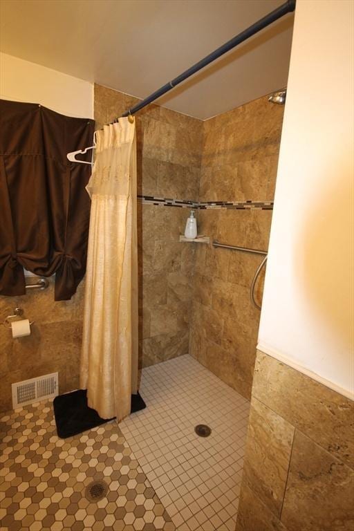 bathroom with a shower with shower curtain