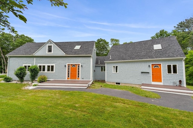 94 Kimball Rd, Amesbury, MA 01931 - view of front of home with a front lawn, a wooden deck, and roof with shingles