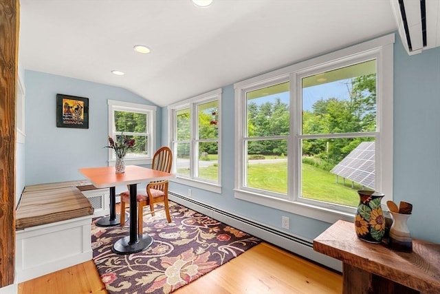 94 Kimball Rd, Amesbury, MA 01931 - dining space with baseboard heating, vaulted ceiling, wood finished floors, and recessed lighting