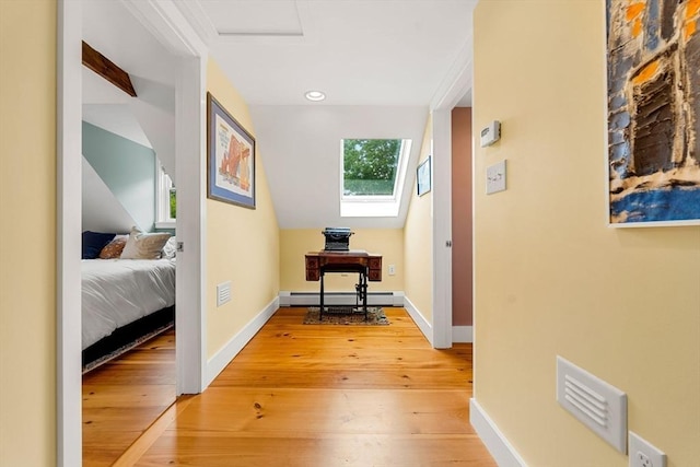 94 Kimball Rd, Amesbury, MA 01931 - hallway featuring a baseboard heating unit, light wood finished floors, and recessed lighting