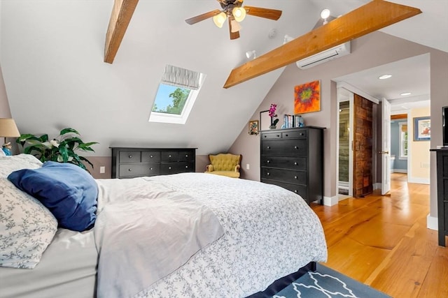 94 Kimball Rd, Amesbury, MA 01931 - bedroom with wood finished floors, a skylight, a wall mounted AC, recessed lighting, and a ceiling fan