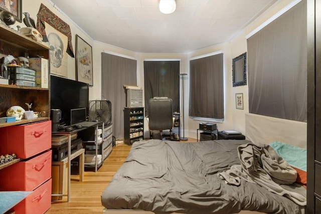 69 Conwell Ave, Somerville, MA 02144 - bedroom with light wood-style floors and crown molding