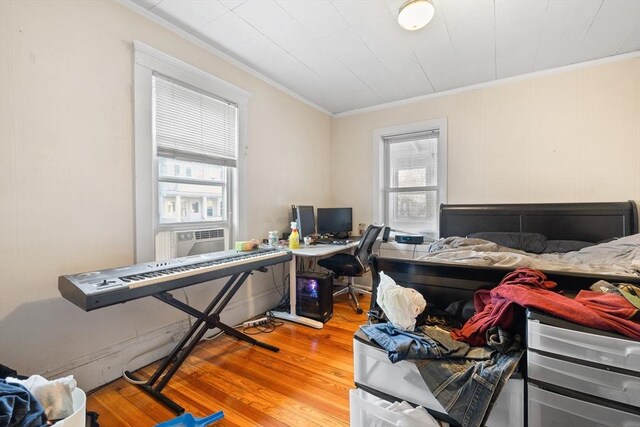 69 Conwell Ave, Somerville, MA 02144 - bedroom featuring ornamental molding, wood finished floors, and an office area