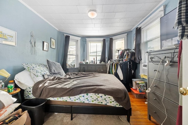 69 Conwell Ave, Somerville, MA 02144 - bedroom with multiple windows, ornamental molding, and wood finished floors