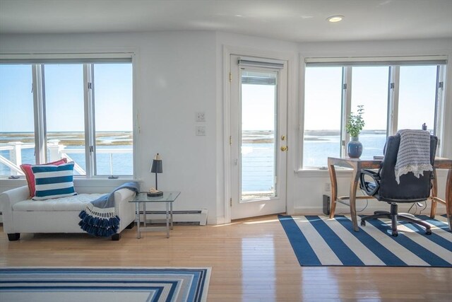 18 Wendy Way, Dennis, MA 02670 - doorway with plenty of natural light, a baseboard radiator, wood finished floors, and recessed lighting