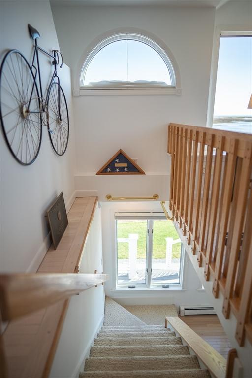 18 Wendy Way, Dennis, MA 02670 - stairway with a baseboard radiator and a healthy amount of sunlight