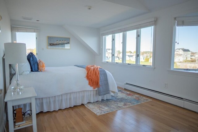 18 Wendy Way, Dennis, MA 02670 - bedroom with visible vents, wood finished floors, and a baseboard radiator