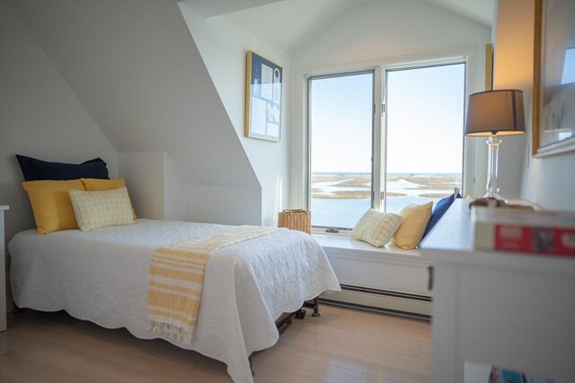 18 Wendy Way, Dennis, MA 02670 - bedroom with baseboard heating, wood finished floors, and lofted ceiling