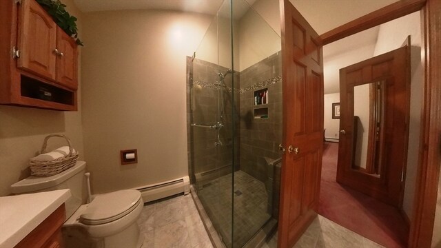 bathroom with vanity, tile patterned floors, a baseboard radiator, toilet, and a shower with door