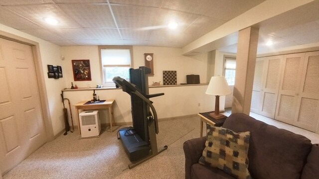 workout room with light colored carpet