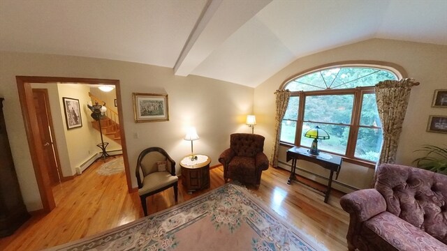 living area featuring a baseboard radiator, light hardwood / wood-style flooring, and lofted ceiling with beams