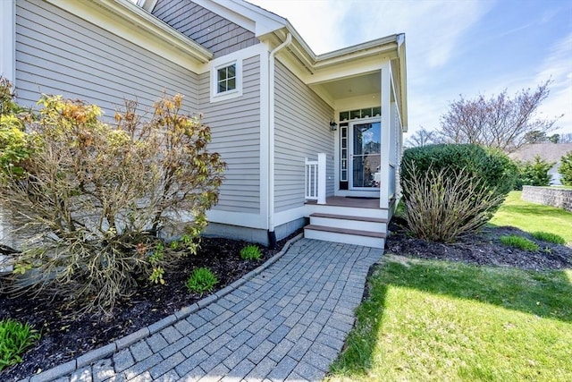 16 Twin Oaks Dr Unit 732, Mashpee, MA 02649 - doorway to property featuring a lawn