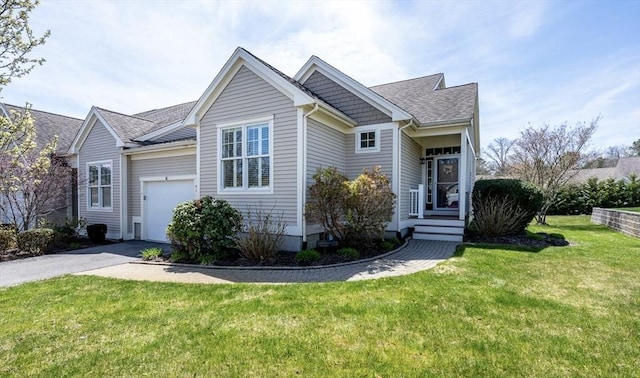 16 Twin Oaks Dr Unit 732, Mashpee, MA 02649 - view of front of property with a garage, aphalt driveway, roof with shingles, and a front yard
