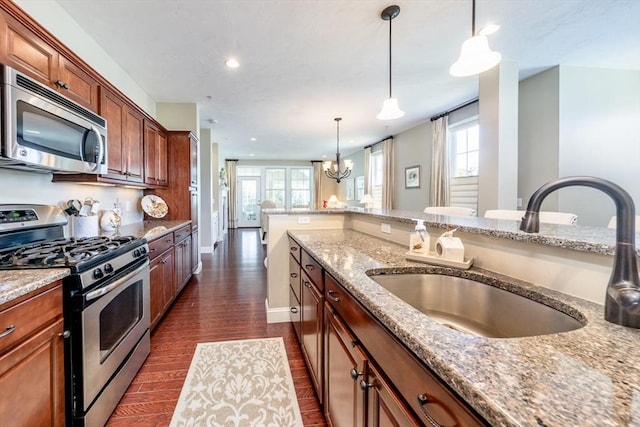 16 Twin Oaks Dr Unit 732, Mashpee, MA 02649 - kitchen with a sink, appliances with stainless steel finishes, a healthy amount of sunlight, and decorative light fixtures