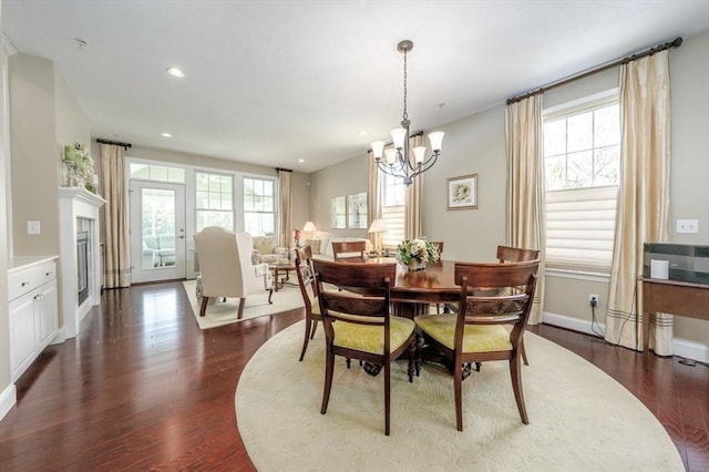 16 Twin Oaks Dr Unit 732, Mashpee, MA 02649 - dining space featuring a chandelier, baseboards, dark wood finished floors, and a healthy amount of sunlight