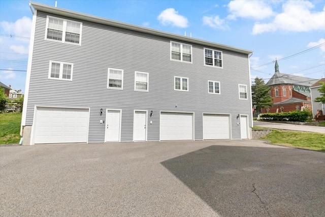 54 Primrose St Unit 3, Haverhill, MA 01830 - view of side of property featuring asphalt driveway and an attached garage
